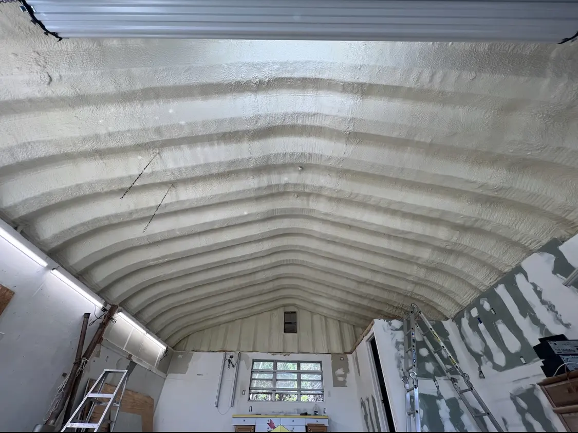Spray polyurethane foam applied to the underside of a metal roof deck in Villa Rica